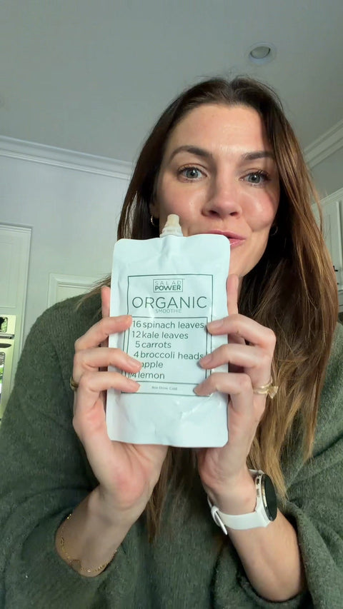 Sarah Brown Carter holding up a SaladPower pouch